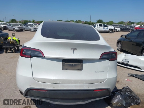 2021 Tesla Model Y Long Range with VIN 5YJYGDEE0MF265339, listed as a IAAI auction lot 41975058 with 51,292 mi miles and . Bid and sale history available at DreamBid. Image 16.