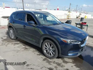 2021 Mazda CX-5 Grand Touring with VIN JM3KFBDM6M1312573, listed as a IAAI auction lot 41936739 with Not Provided miles and . Bid and sale history available at DreamBid. Image 1.