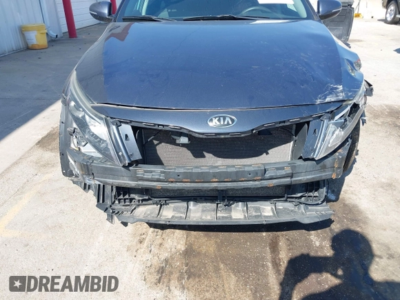 2015 Kia Optima LX with VIN 5XXGM4A77FG381505, listed as a IAAI auction lot 42105568 with 164,641 mi miles and . Bid and sale history available at DreamBid. Image 6.
