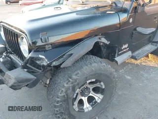 2004 Jeep Wrangler SE with VIN 1J4FA29184P762210, listed as a IAAI auction lot 40983051 with 107,525 mi miles and . Bid and sale history available at DreamBid. Image 6.
