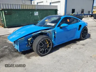 2023 Porsche 911 Turbo z VIN WP0AD2A97PS258306, wystawiony jako Copart lot #61753825 z przebiegiem 2 879 mil mil oraz Szkoda całkowita • Salvage title. Historia ofert i sprzedaży dostępna na DreamBid. Obrazek 1.