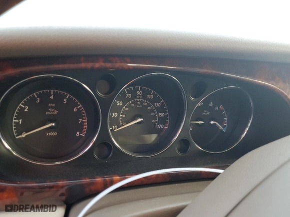 2005 Jaguar XJ with VIN SAJWA79C05SG37189, listed as a Copart auction lot 76804104 with 0 mi miles and Salvage Title. Bid and sale history available at carsss.com. Image 9.