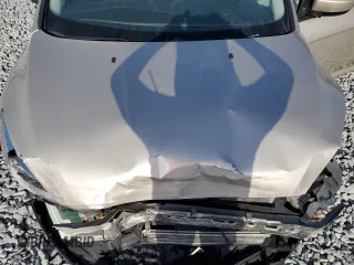 2018 Ford Focus SE with VIN 1FADP3FE4JL201052, listed as a Copart auction lot 51893595 with 87,627 mi miles and Salvage Title. Bid and sale history available at carsss.com. Image 11.