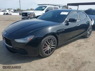 2015 Maserati Ghibli with VIN ZAM57XSA9F1146055, listed as a IAAI auction lot 41814633 with 88,783 mi miles. Bid and sale history available at carsss.com. Image 2.