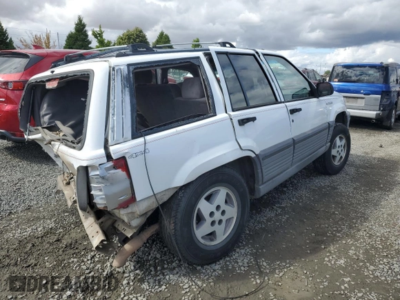 1994 Jeep Grand Cherokee Laredo with VIN 1J4GZ58Y2RC207099, listed as a Copart auction lot 71176114 with 127,110 mi miles and Salvage Title. Bid and sale history available at carsss.com. Image 3.