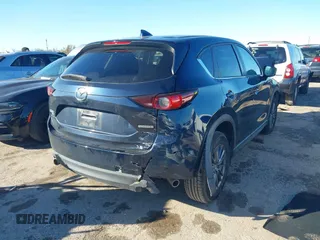 2021 Mazda CX-5 Touring with VIN JM3KFBCM3M1454879, listed as a IAAI auction lot 41311785 with 39,020 mi miles. Bid and sale history available at carsss.com. Image 4.