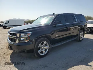 2015 Chevrolet Suburban LT with VIN 1GNSCJKC9FR732720, listed as a Copart auction lot 62564765 with 99,194 mi miles and Salvage title. Bid and sale history available at DreamBid. Image 1.