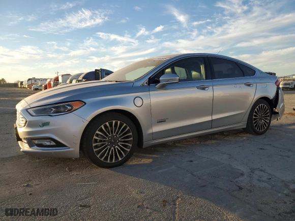 2017 Ford Fusion Energi Titanium with VIN 3FA6P0SUXHR379807, listed as a Copart auction lot 84885494 with 100,735 mi miles and Salvage Title. Bid and sale history available at carsss.com. Image 1.