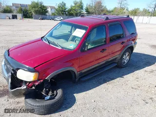 2004 Ford Escape XLT with VIN 1FMCU931X4KB19738, listed as a IAAI auction lot 41925561 with 220,674 mi miles. Bid and sale history available at carsss.com. Image 2.