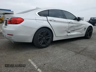 2015 BMW 4 Series 428i xDrive with VIN WBA4C9C59FD331372, listed as a Copart auction lot 58628665 with 81,245 mi miles and Salvage title. Bid and sale history available at DreamBid. Image 3.