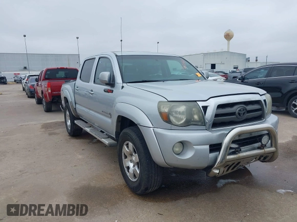 2009 Toyota Tacoma PreRunner with VIN 3TMJU62NX9M081748, listed as a IAAI auction lot 41608525 with 210,999 mi miles. Bid and sale history available at carsss.com. Image 1.