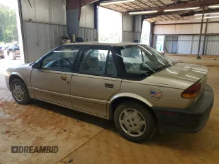 1995 Saturn SL with VIN 1G8ZH5280SZ302560, listed as a Copart auction lot 63290495 with 123,475 mi miles and Clean title. Bid and sale history available at DreamBid. Image 2.