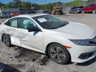2018 Honda Civic EX-L z VIN 19XFC1F70JE000634, wystawiony jako IAAI lot #42020912 z przebiegiem 156 030 mil mil oraz . Historia ofert i sprzedaży dostępna na DreamBid. Obrazek 13.
