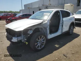 2020 Mazda CX-5 Grand Touring with VIN JM3KFBDM0L1851740, listed as a Copart auction lot 61531275 with 59,534 mi miles and Salvage title. Bid and sale history available at DreamBid. Image 1.