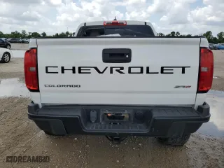 2021 Chevrolet Colorado 4WD ZR2 with VIN 1GCGTEEN0M1108190, listed as a Copart auction lot 54159655 with 64,447 mi miles and Salvage Title. Bid and sale history available at carsss.com. Image 6.