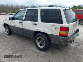 1996 Jeep Grand Cherokee Laredo with VIN 1J4FX58S1TC278511, listed as a IAAI auction lot 41837339 with 303,947 mi miles. Bid and sale history available at carsss.com. Image 3.