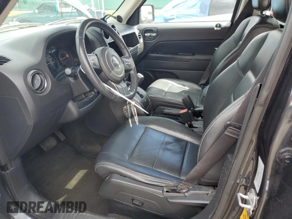 2015 Jeep Patriot High Altitude with VIN 1C4NJRFB9FD258471, listed as a Copart auction lot 54759735 with 127,823 mi miles and Salvage title. Bid and sale history available at DreamBid. Image 7.