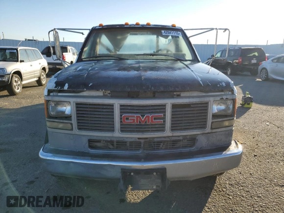 1991 GMC Sierra 1500 with VIN 1GDKC34N5MJ510668, listed as a Copart auction lot 42041115 with 294,934 mi miles and Clean Title. Bid and sale history available at DreamBid. Image 5.