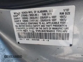 2007 Honda Odyssey EX with VIN 5FNRL38457B042912, listed as a IAAI auction lot 41992847 with 194,822 mi miles and . Bid and sale history available at DreamBid. Image 9.