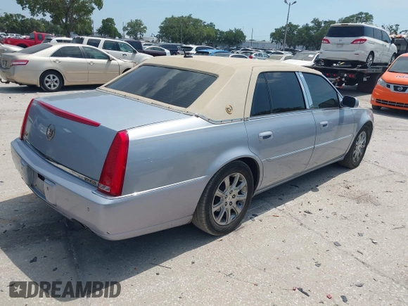 2006 Cadillac DTS 1SC z VIN 1G6KD57Y56U109483, wystawiony jako IAAI lot #42103757 z przebiegiem 106 746 mil mil oraz . Historia ofert i sprzedaży dostępna na DreamBid. Obrazek 4.