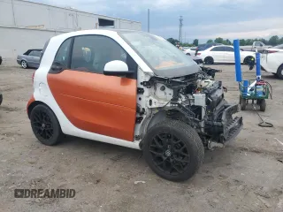 2016 Smart fortwo Passion with VIN WMEFJ5DA0GK060576, listed as a Copart auction lot 55641565 with 99,558 mi miles and Salvage title. Bid and sale history available at DreamBid. Image 4.