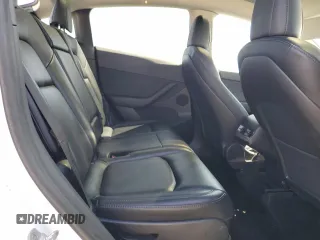 2022 Tesla Model Y Long Range z VIN 7SAYGAEE6NF492070, wystawiony jako Copart lot #52032415 z przebiegiem 143 732 mil mil oraz Szkody całkowita. Historia ofert i sprzedaży dostępna na DreamBid. Obrazek 11.