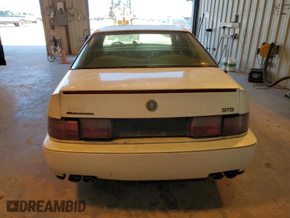 1993 Cadillac Seville Touring STS z VIN 1G6KY5295PU817593, wystawiony jako Copart lot #47807075 z przebiegiem Nie podano mil oraz Czysty tytuł • Clean title. Historia ofert i sprzedaży dostępna na DreamBid. Obrazek 6.