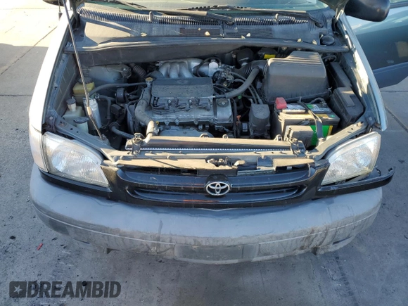1999 Toyota Sienna CE with VIN 4T3ZF19C2XU100132, listed as a Copart auction lot 75251124 with 217,399 mi miles and Salvage Title. Bid and sale history available at carsss.com. Image 12.