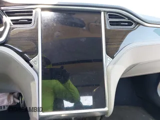 2014 Tesla Model S 60 with VIN 5YJSA1H19EFP36971, listed as a IAAI auction lot 42525811 with Not provided miles and . Bid and sale history available at DreamBid. Image 19.