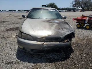 1999 Lexus ES 300 z VIN JT8BF28G6X0220031, wystawiony jako Copart lot #57346835 z przebiegiem Nie podano mil oraz Szkoda całkowita • Salvage title. Historia ofert i sprzedaży dostępna na DreamBid. Obrazek 5.