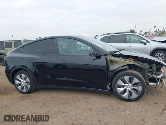 2023 Tesla Model Y Long Range with VIN 7SAYGDEEXPA044335, listed as a IAAI auction lot 42350159 with 26,731 mi miles and . Bid and sale history available at DreamBid. Image 14.