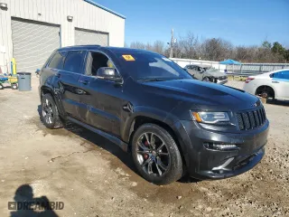 2015 Jeep Grand Cherokee SRT with VIN 1C4RJFDJ1FC663370, listed as a Copart auction lot 86608514 with 123,209 mi miles and Salvage Title. Bid and sale history available at carsss.com. Image 4.