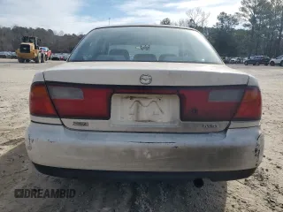 1998 Mazda Protege DX z VIN JM1BC1416W0194406, wystawiony jako Copart lot #44535955 z przebiegiem 312 942 mil mil oraz Szkoda całkowita • Salvage title. Historia ofert i sprzedaży dostępna na DreamBid. Obrazek 6.
