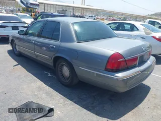 2000 Mercury Grand Marquis GS z VIN 2MEFM74W8YX662409, wystawiony jako IAAI lot #42438486 z przebiegiem 191 248 mil mil oraz . Historia ofert i sprzedaży dostępna na DreamBid. Obrazek 3.