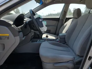 2008 Kia Optima LX z VIN KNAGE123185190108, wystawiony jako Copart lot #59364195 z przebiegiem 131 344 mil mil oraz Szkoda całkowita • Salvage title. Historia ofert i sprzedaży dostępna na DreamBid. Obrazek 7.