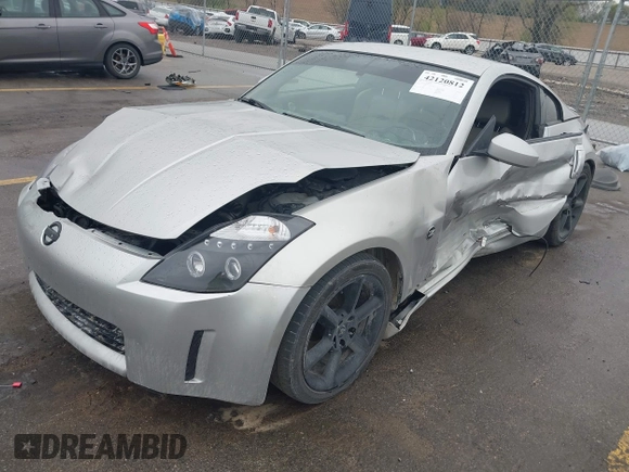 2003 Nissan 350Z Touring z VIN JN1AZ34E43T014247, wystawiony jako IAAI lot #42120812 z przebiegiem 112 263 mil mil oraz . Historia ofert i sprzedaży dostępna na DreamBid. Obrazek 2.