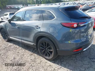 2021 Mazda CX-9 Grand Touring with VIN JM3TCADY7M0528223, listed as a IAAI auction lot 42395861 with 57,767 mi miles and . Bid and sale history available at DreamBid. Image 3.