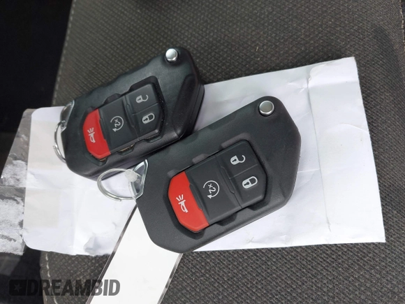 2023 Jeep Wrangler Sport S with VIN 1C4HJXDG2PW582318, listed as a IAAI auction lot 42011653 with 25,338 mi miles and . Bid and sale history available at DreamBid. Image 11.