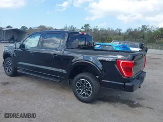 2023 Ford F-150 XL with VIN 1FTEW1EP3PKD05149, listed as a IAAI auction lot 41568543 with 5,594 mi miles. Bid and sale history available at carsss.com. Image 3.