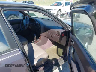 1996 Toyota Camry DX with VIN 4T1BG12K8TU915891, listed as a IAAI auction lot 41874731 with 57,564 mi miles. Bid and sale history available at carsss.com. Image 5.