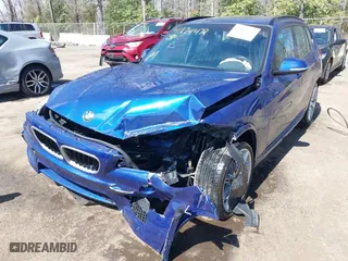 2015 BMW X1 sDrive28i with VIN WBAVM1C58FV314947, listed as a IAAI auction lot 41874472 with 128,271 mi miles. Bid and sale history available at carsss.com. Image 6.