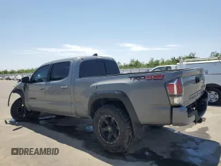 2020 Toyota Tacoma SR5 z VIN 3TMDZ5BN0LM094976, wystawiony jako Copart lot #58695515 z przebiegiem 84 025 mil mil oraz Czysty tytuł • Clean title. Historia ofert i sprzedaży dostępna na DreamBid. Obrazek 2.