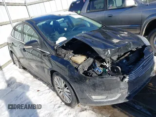 2015 Ford Focus Titanium with VIN 1FADP3J22FL323185, listed as a IAAI auction lot 41461154 with 125,477 mi miles and . Bid and sale history available at carsss.com. Image 1.