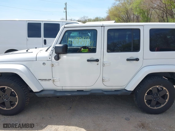 2012 Jeep Wrangler Unlimited Sahara with VIN 1C4HJWEG3CL254944, listed as a IAAI auction lot 42060981 with 172,358 mi miles. Bid and sale history available at carsss.com. Image 14.