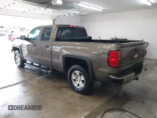 2014 Chevrolet Silverado 1500 LT with VIN 1GCVKREC5EZ147506, listed as a IAAI auction lot 41736960 with 112,399 mi miles and . Bid and sale history available at DreamBid. Image 3.