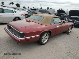 1995 Jaguar XJS with VIN SAJNX2742SC197388, listed as a Copart auction lot 76579714 with 99,077 mi miles and Salvage Title. Bid and sale history available at carsss.com. Image 3.
