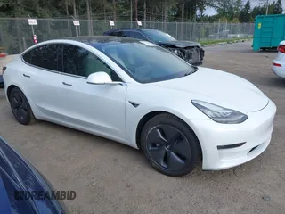 2020 Tesla Model 3 Standard Range Plus with VIN 5YJ3E1EA5LF613002, listed as a IAAI auction lot 42129085 with 55,672 mi miles. Bid and sale history available at carsss.com. Image 14.