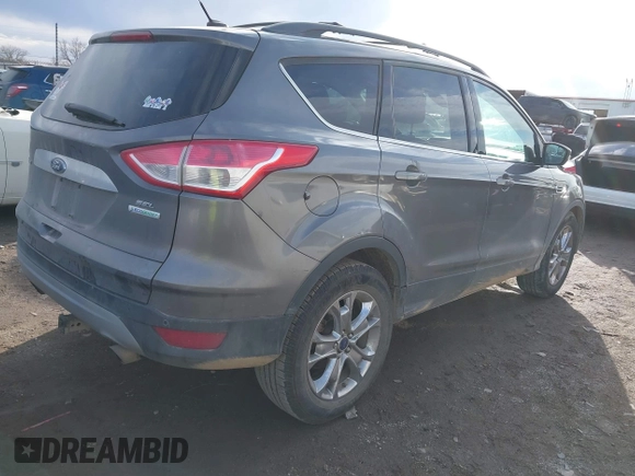 2013 Ford Escape SEL with VIN 1FMCU0HX1DUD51965, listed as a IAAI auction lot 41667262 with 164,493 mi miles and . Bid and sale history available at DreamBid. Image 4.