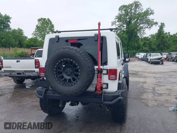 2014 Jeep Wrangler Unlimited Rubicon with VIN 1C4HJWFG4EL104827, listed as a IAAI auction lot 42236622 with 90,935 mi miles and . Bid and sale history available at DreamBid. Image 17.