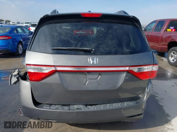 2012 Honda Odyssey EX-L with VIN 5FNRL5H60CB094682, listed as a IAAI auction lot 41570797 with 127,890 mi miles and . Bid and sale history available at carsss.com. Image 16.